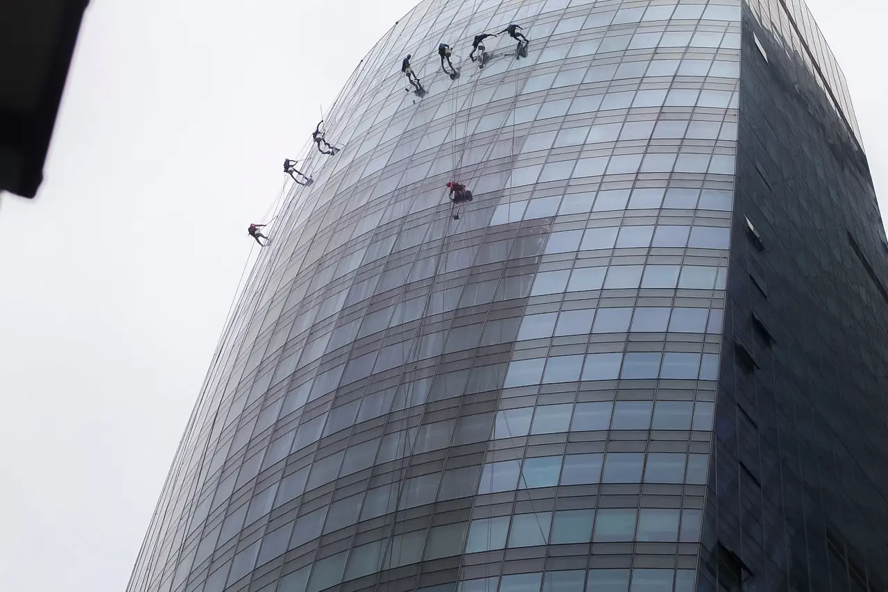 Urban Solutions rope-access team working on a high-rise glass façade